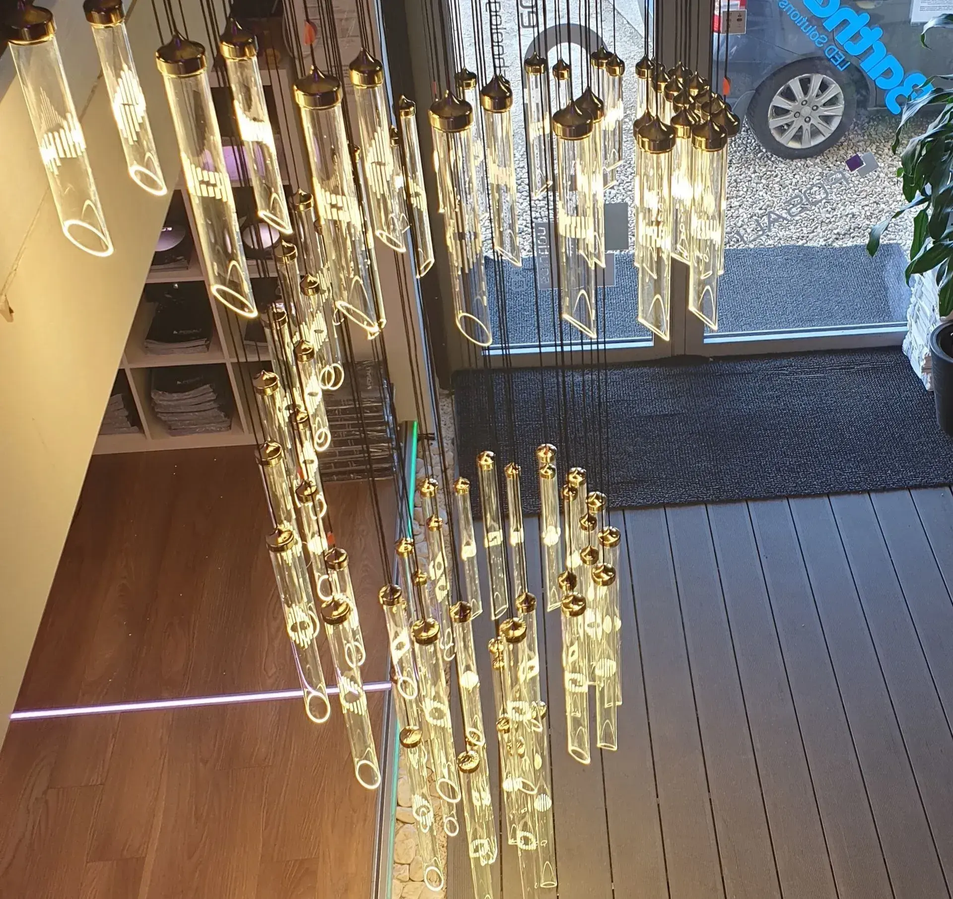SOLINA FOSALI modern chandelier glass tube design in showroom top view