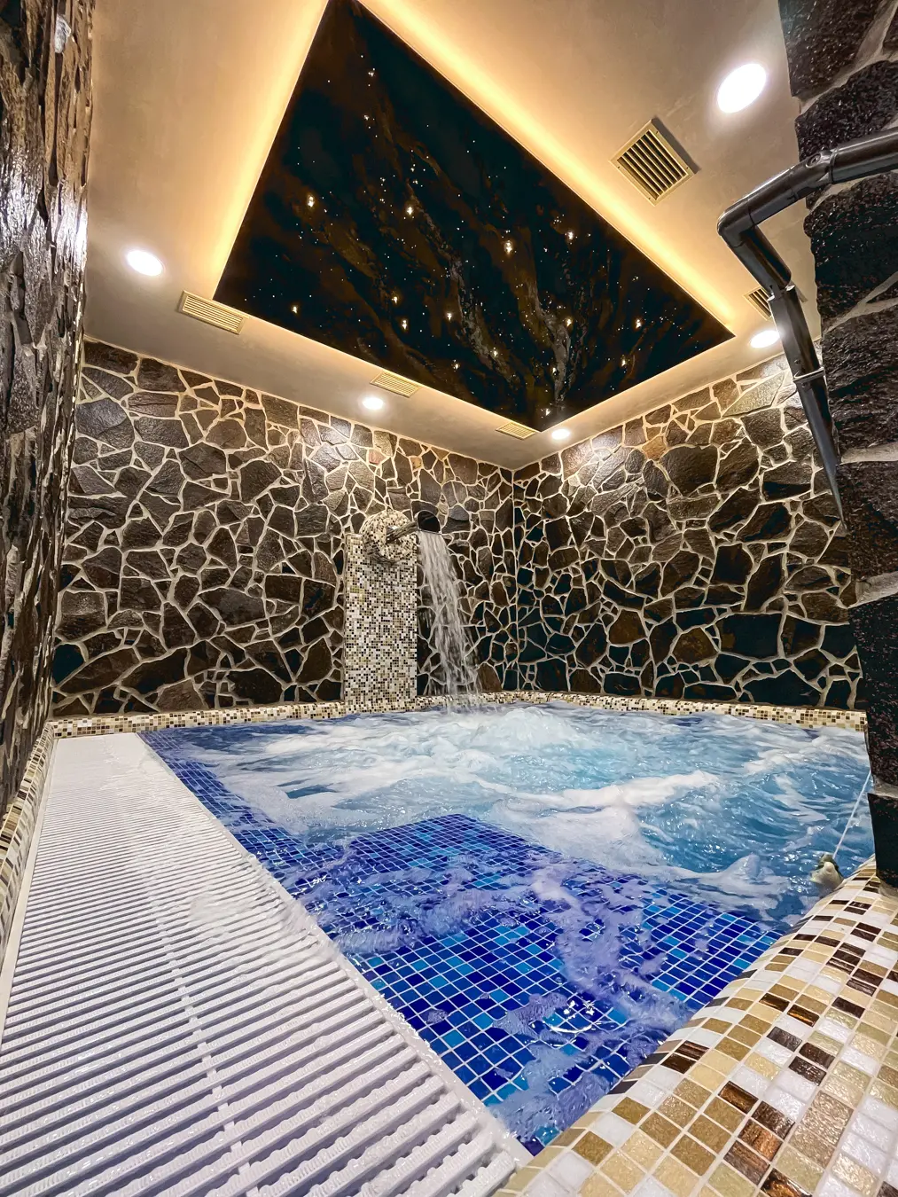 Starry sky fiber optic ceiling panel in wellness above whirlpool effect lighting