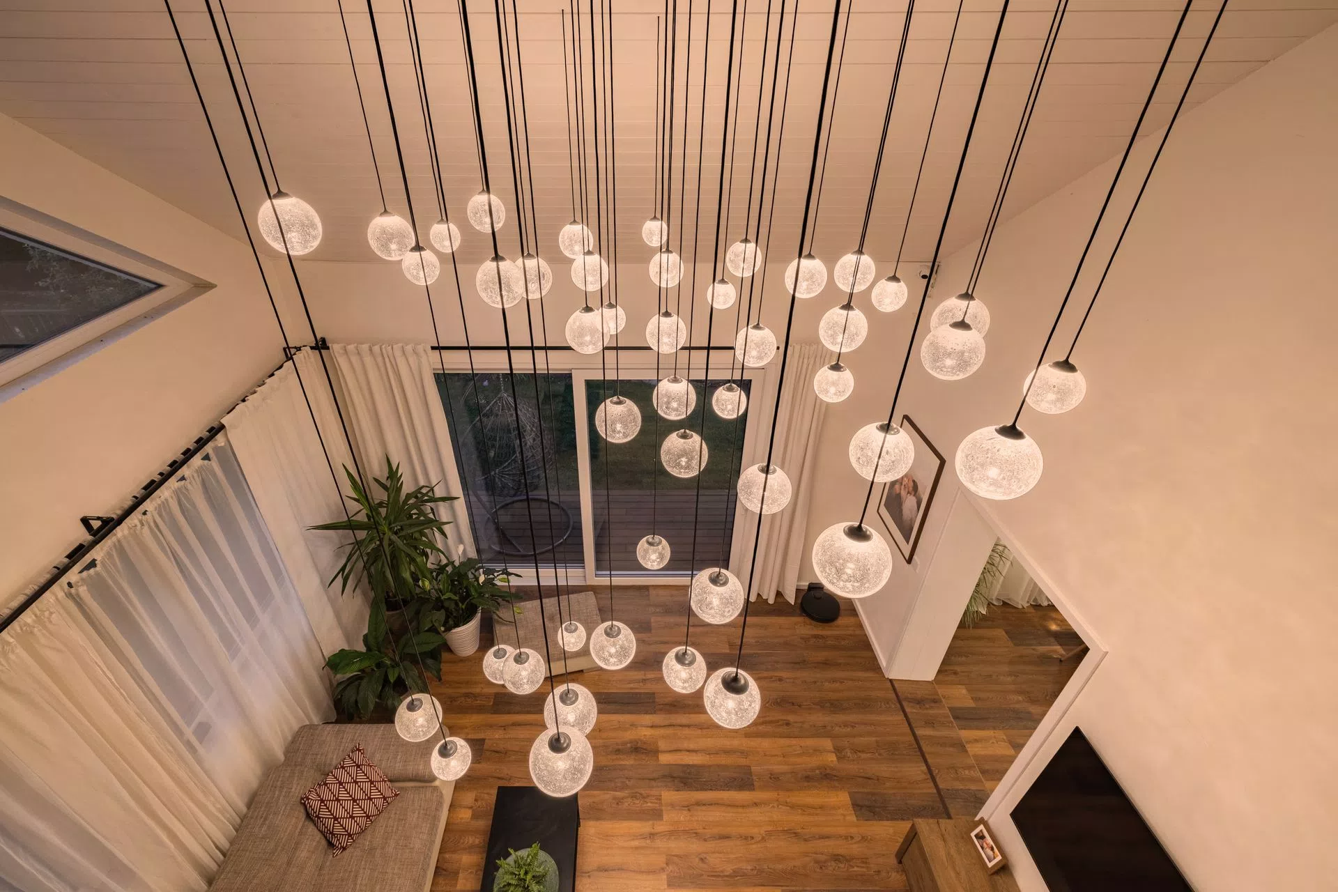 Livingroom chandelier ELUDA is baseless custom made digitally pixel driven chandelier with dynamic effects and massive power, to light up perfectly whole 2-storey livingroom