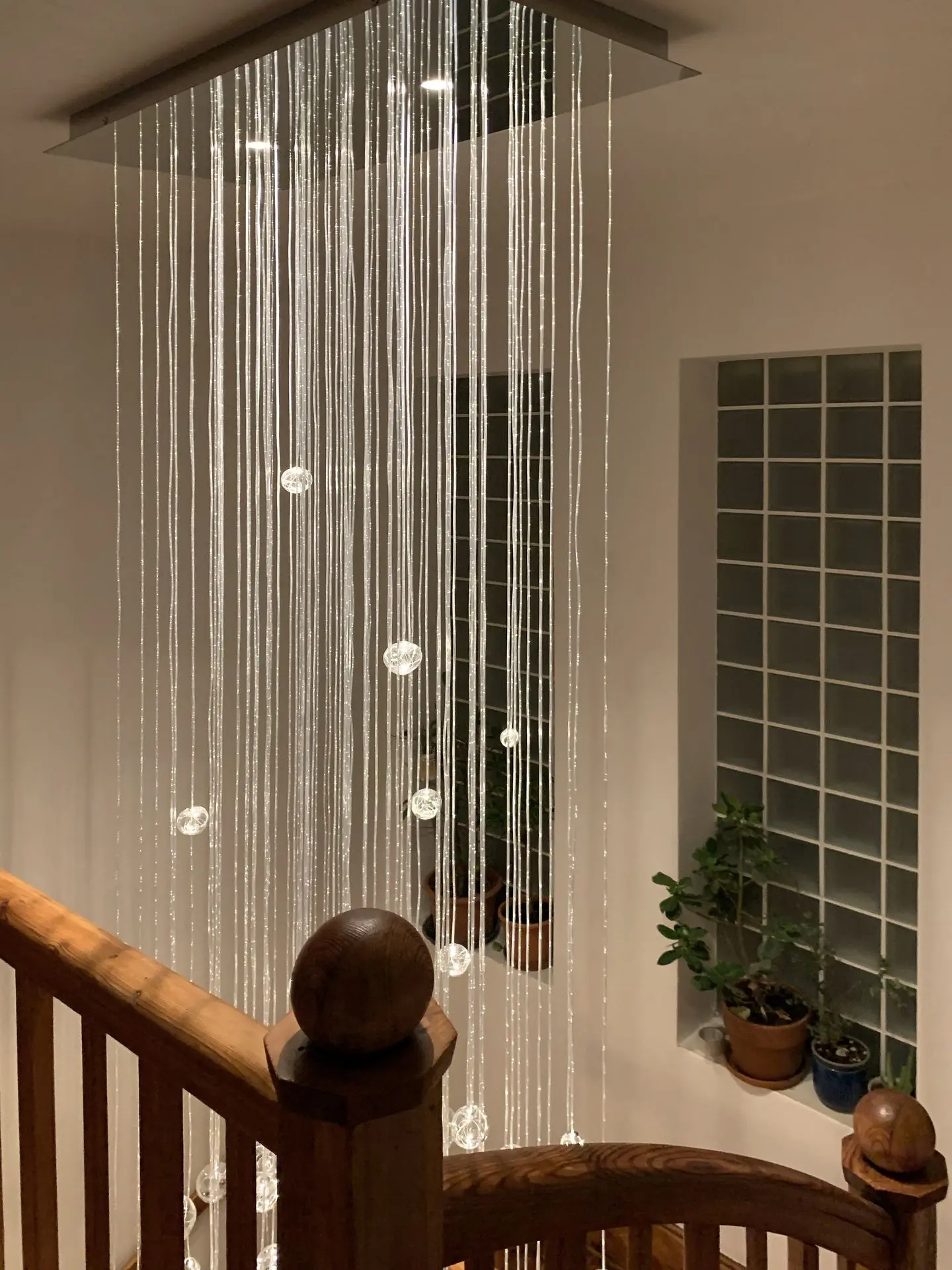 Aquila is fiber optic chandelier ideal for tall spaces such as staircase and entrance hallways