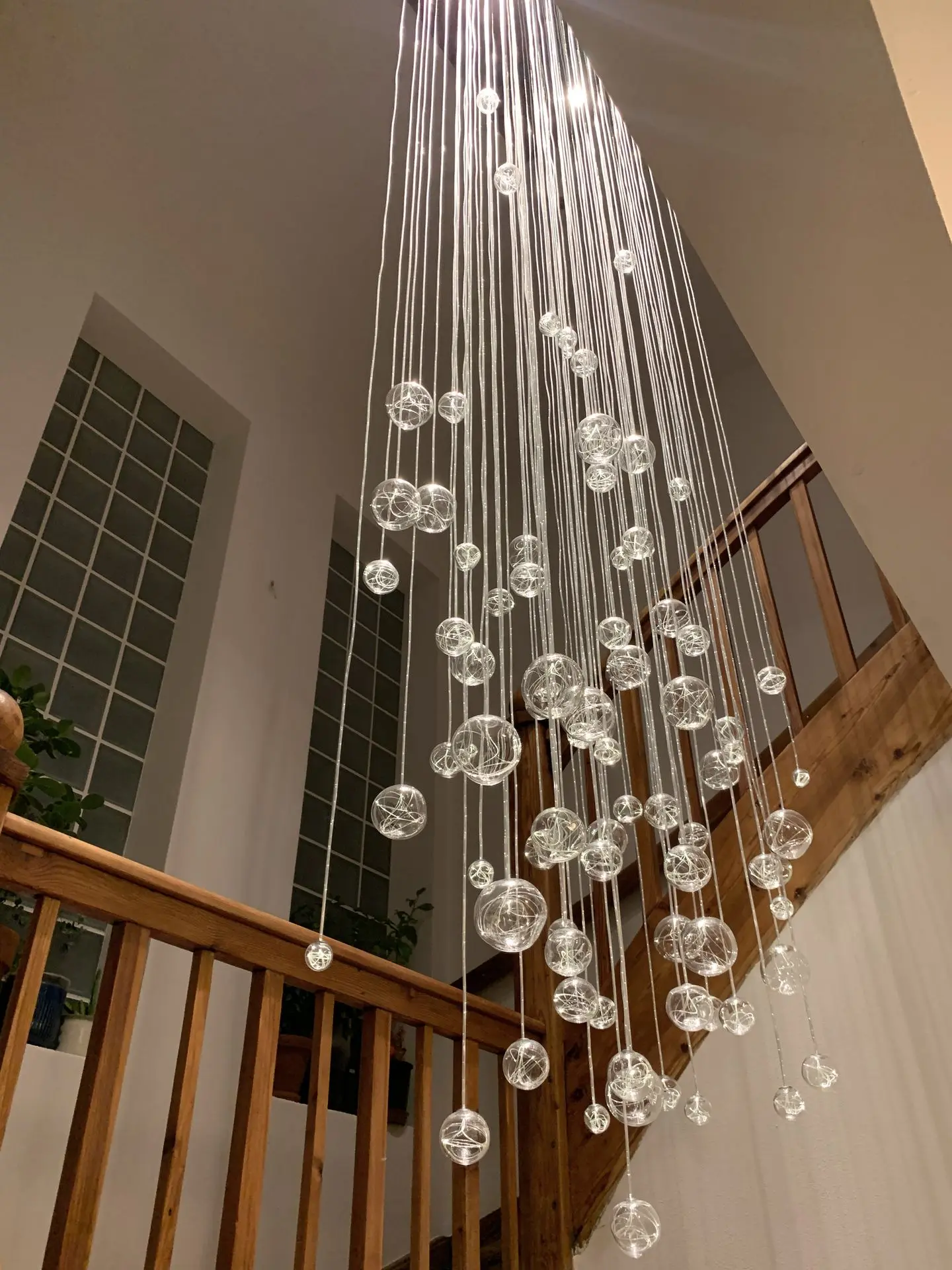 Fiber optic chandelier AQUILA on staircase view from bellow