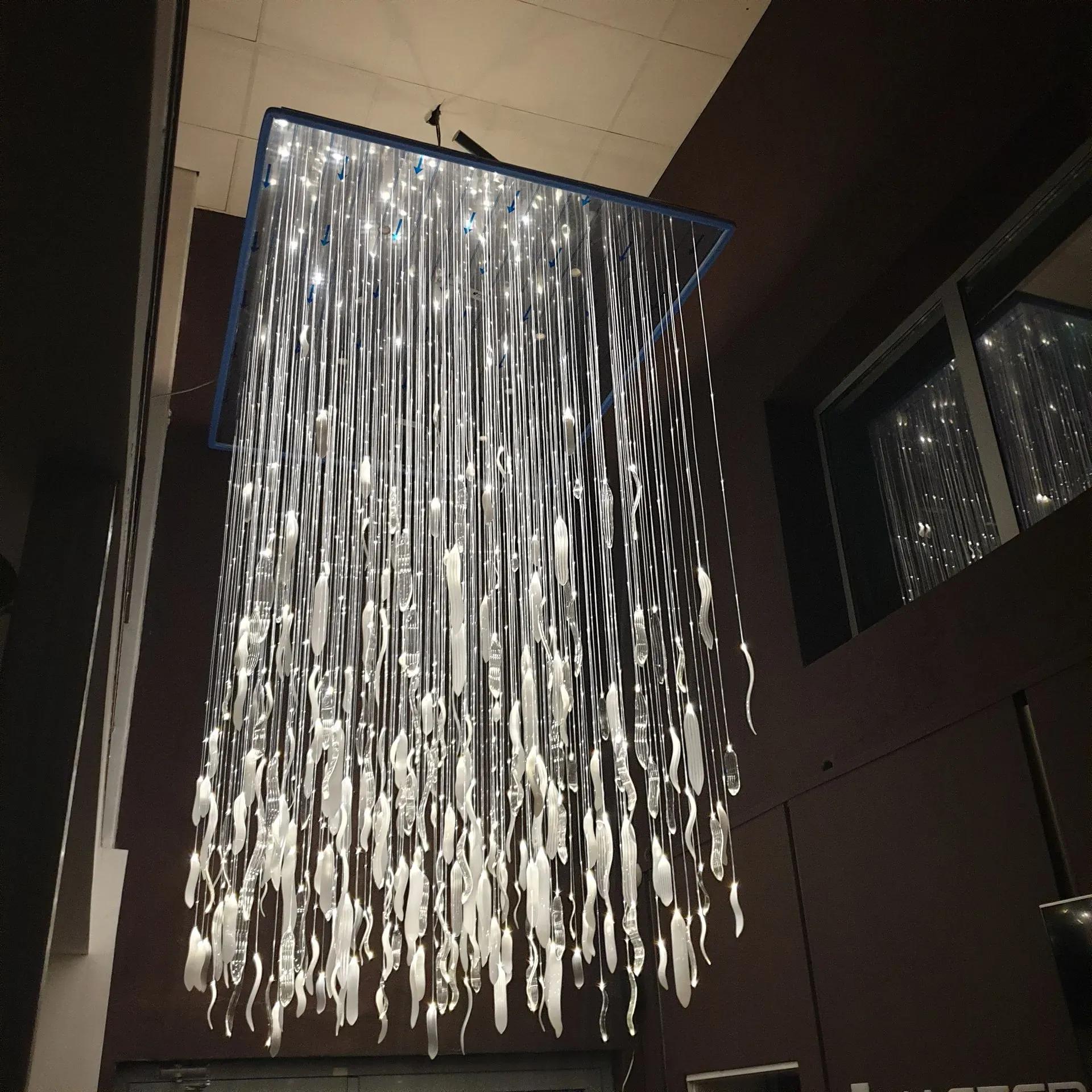 ASTER modern fibre optic decorative chandelier with glass leaves and downlights in studio