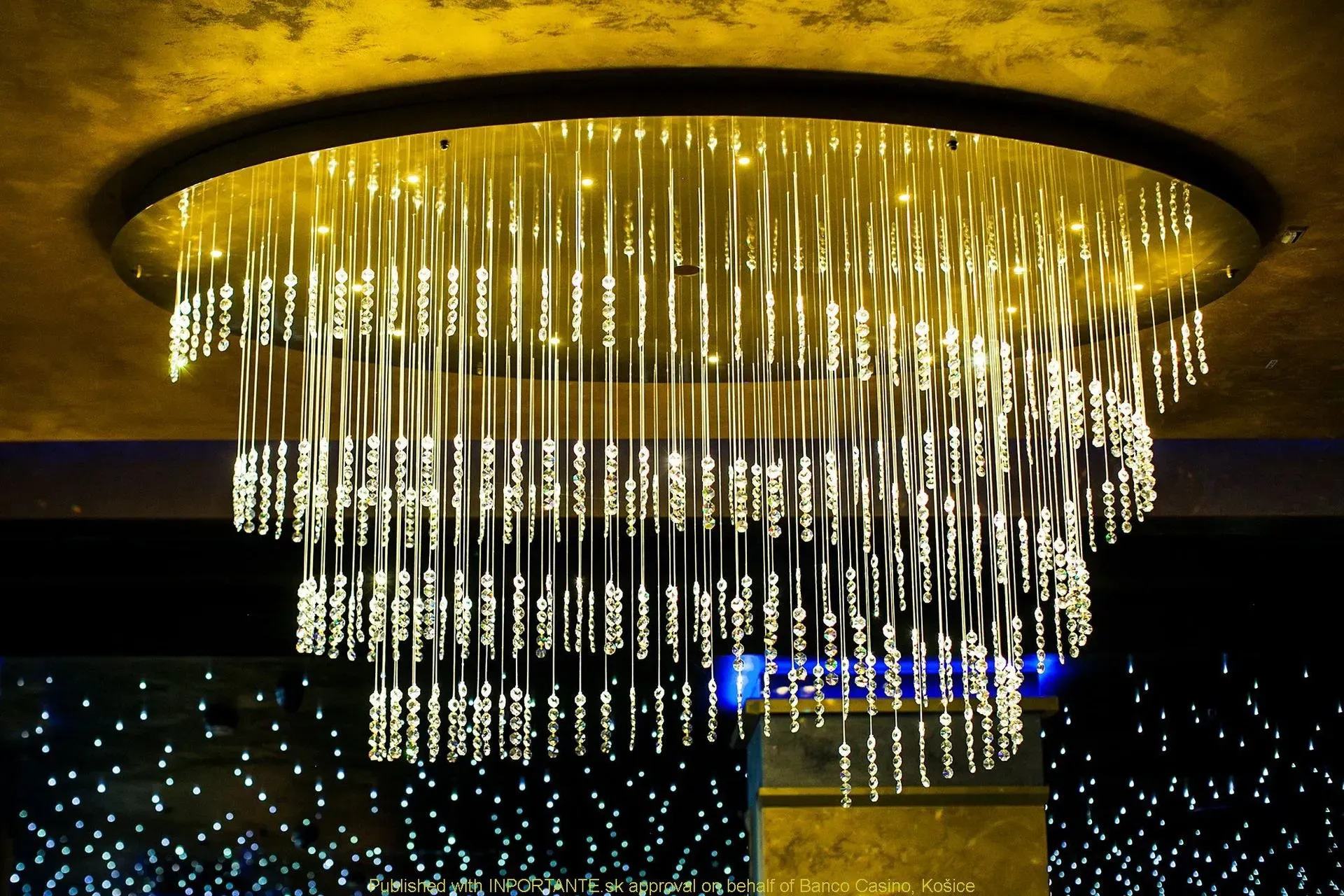 Detail of unique modern chandelier TWIRL by FOSALI is made of fibre optic system and crystals for decorative lighting casino