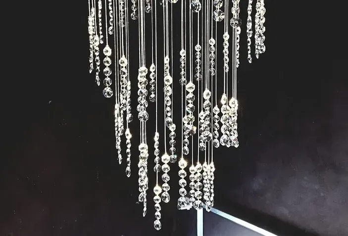 Close Detail of unique modern chandelier TWIRL by FOSALI is made of fibre optic system and crystals for decorative lighting