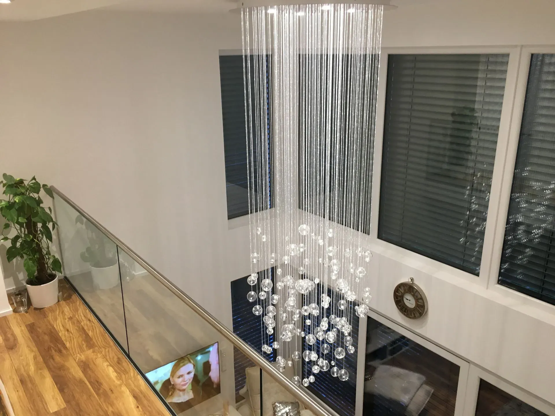Staircase chandelier modern lighting in luxury house stairway