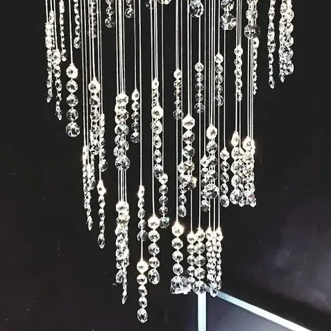 Close Detail of unique modern chandelier TWIRL by FOSALI is made of fibre optic system and crystals for decorative lighting